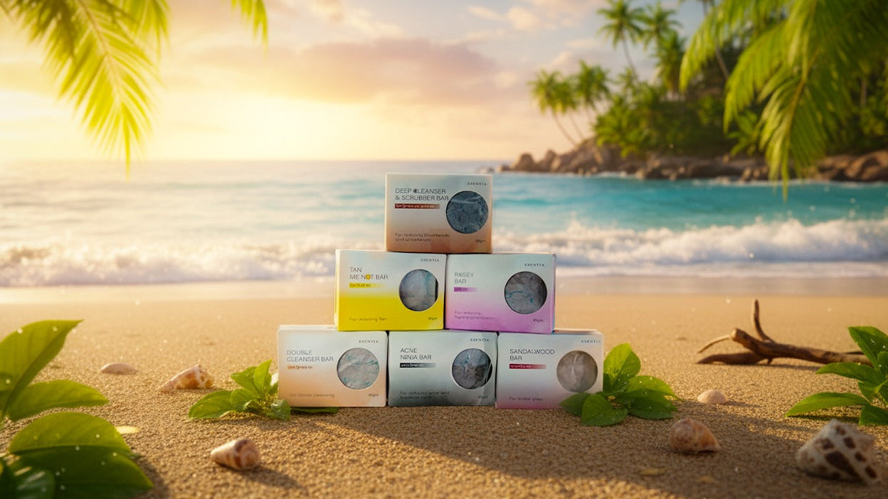 Stack of boxes with 'Esentia' branding on a beach with palm trees and ocean in the background.